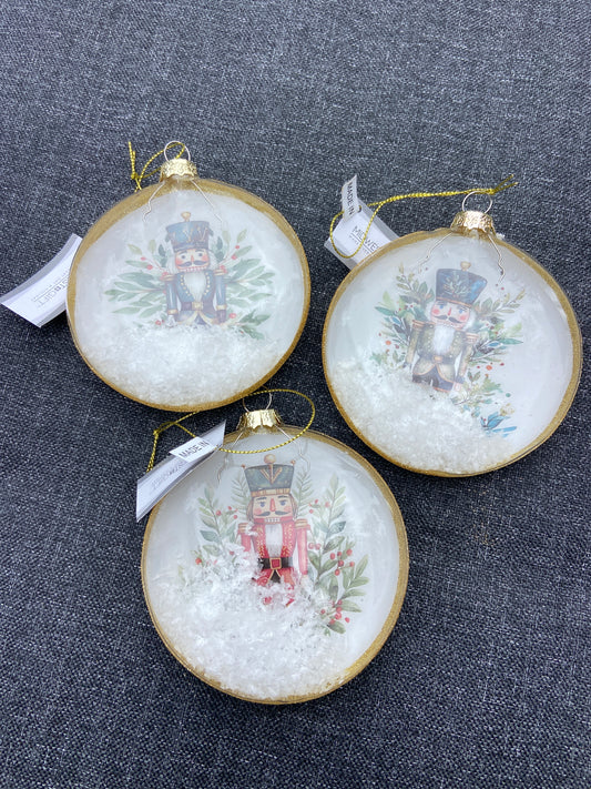 Nutcracker Glass Circular Ornament W/Snow ASST